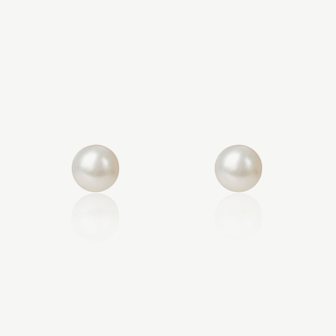 Pair of pearl earrings on a white background