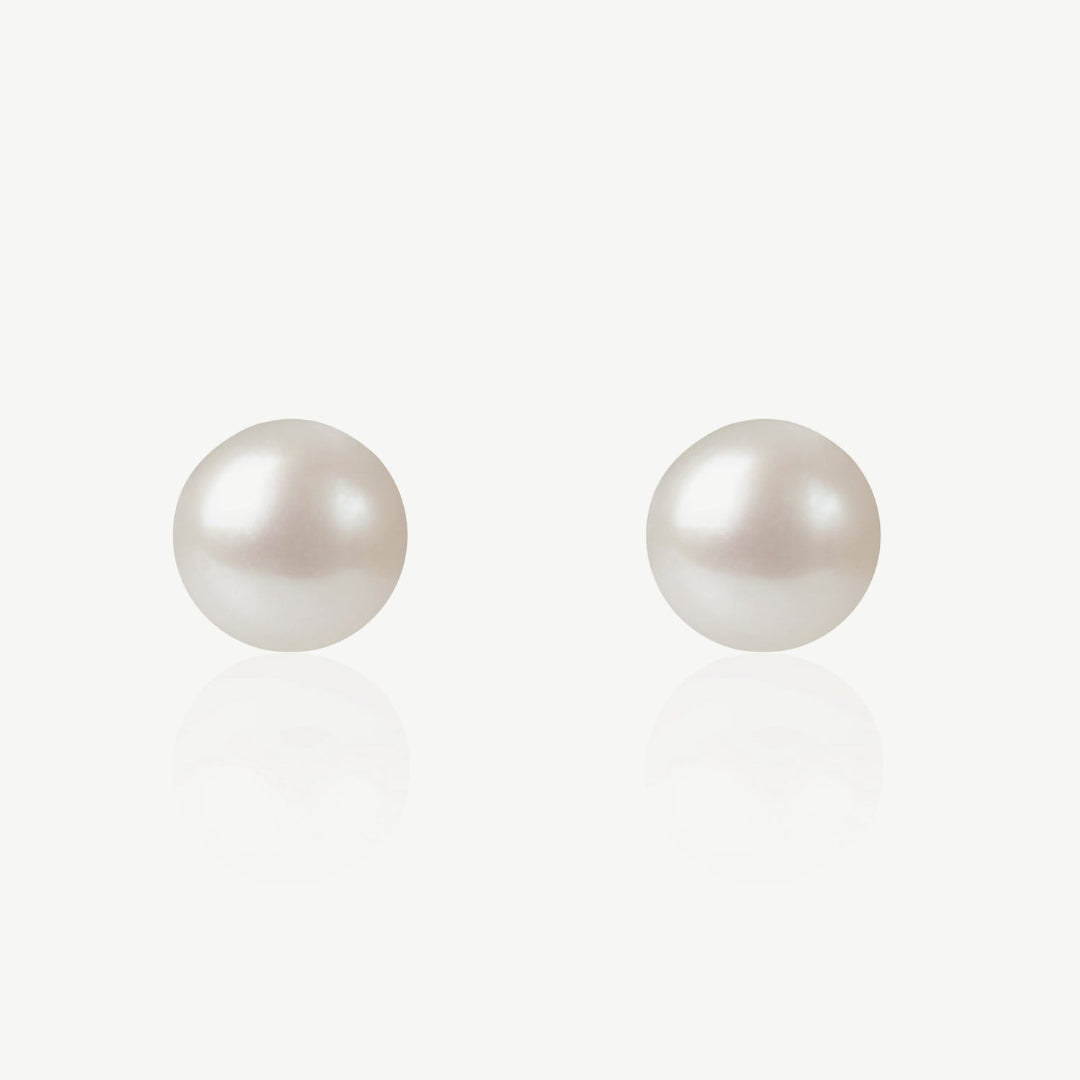 Pair of pearl earrings on a white background
