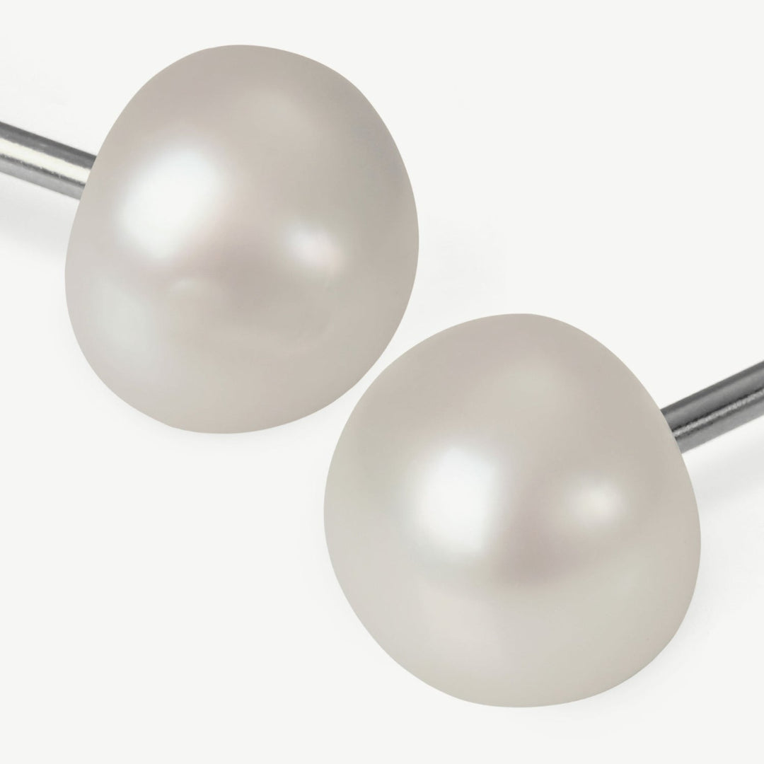 Pair of pearl earrings on a white background