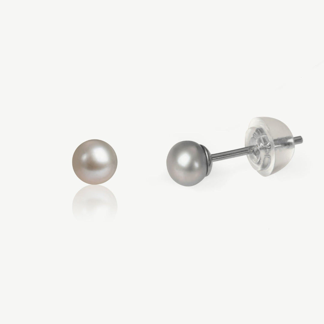 Butterfly-shaped diamond earrings on a white background