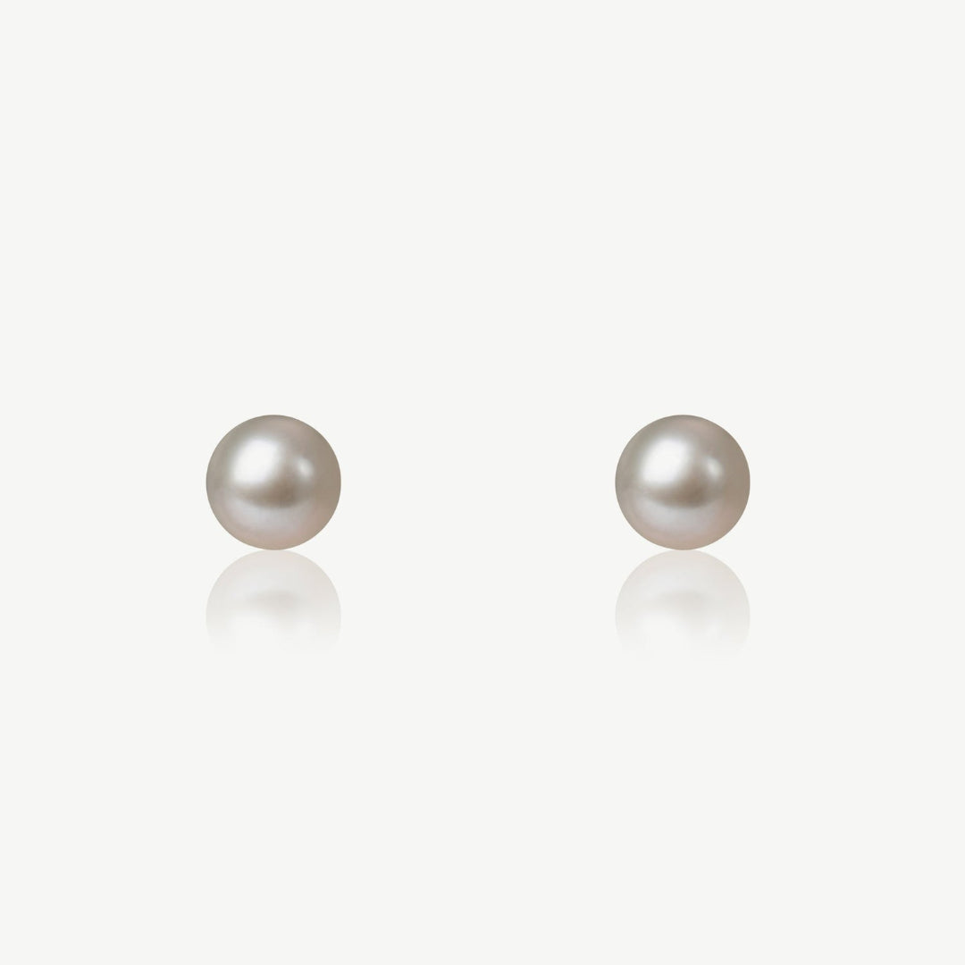 Pair of pearl earrings on a white background