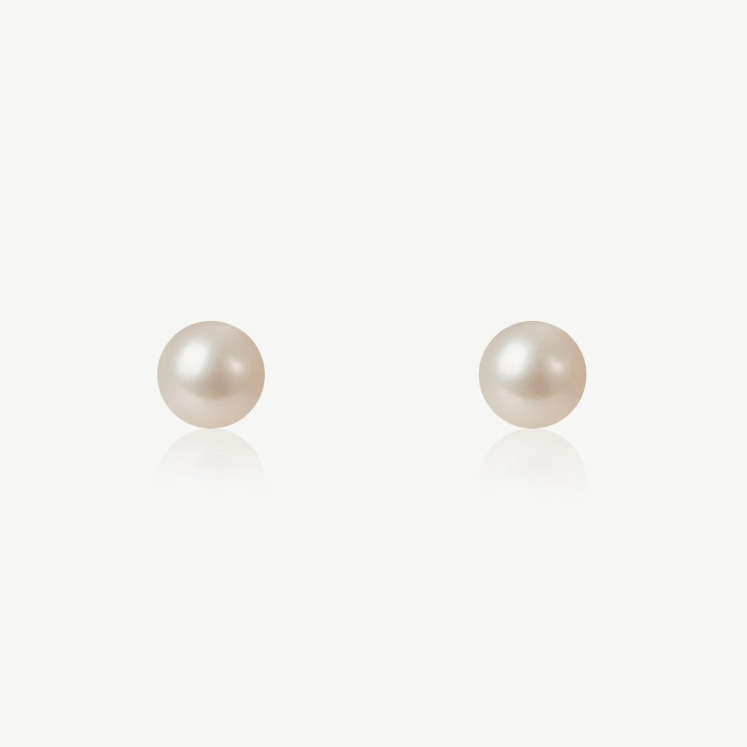 Pair of pearl earrings on a white background
