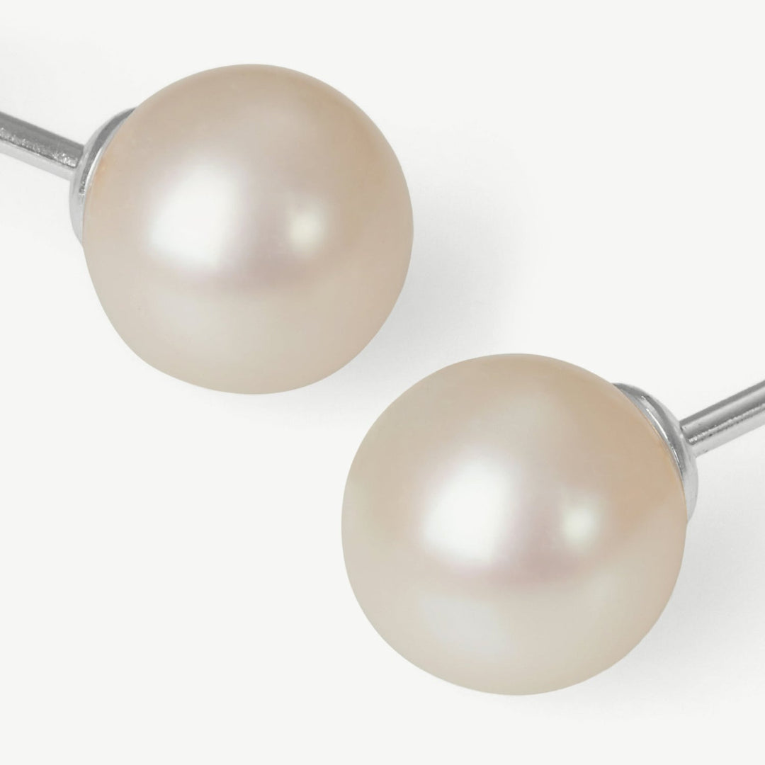 Pearl earrings on a white background