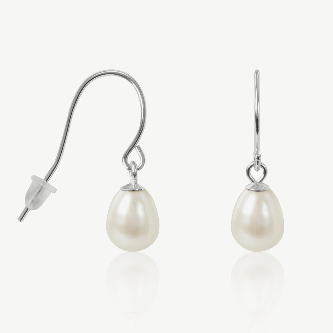 Pearl earrings with silver hooks on a white background