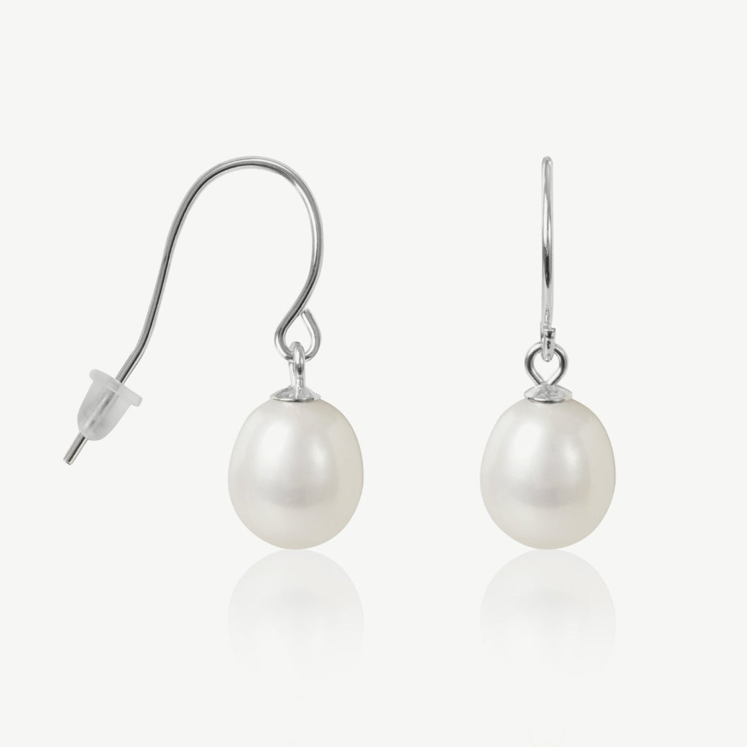 Pearl earrings with silver hooks on a white background