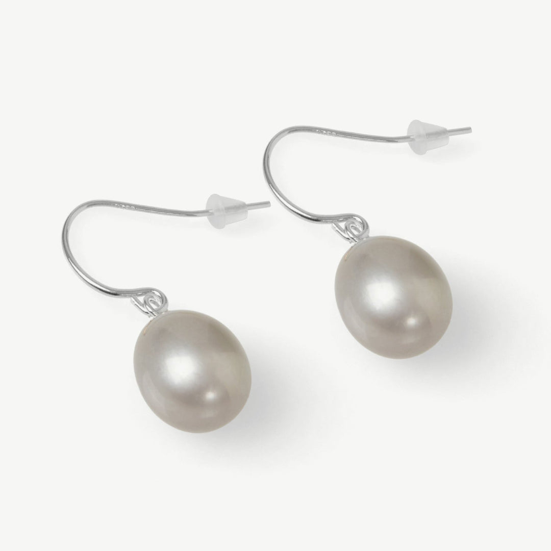 Pearl earrings on a white background