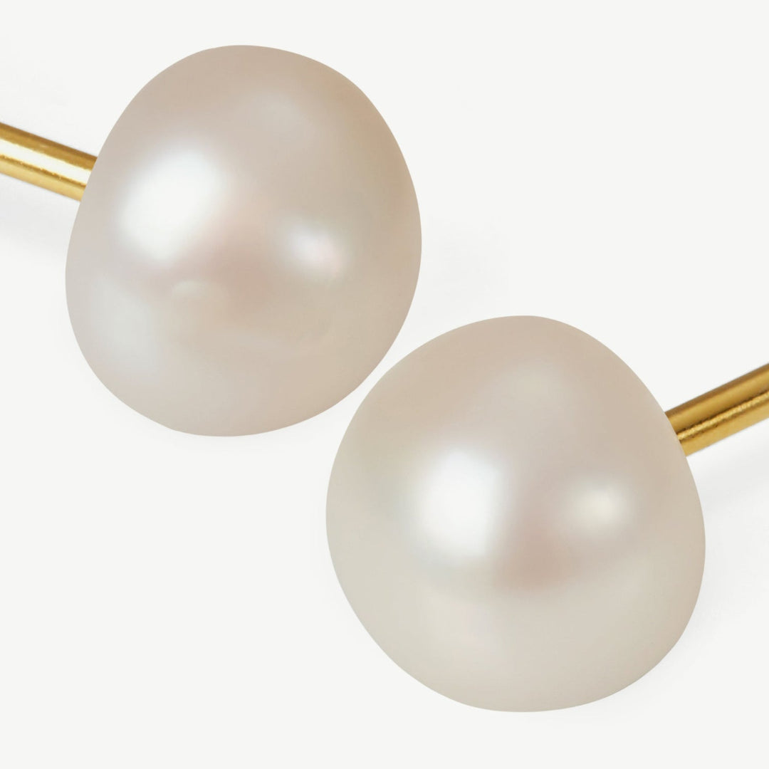 Pair of pearl earrings on a white background