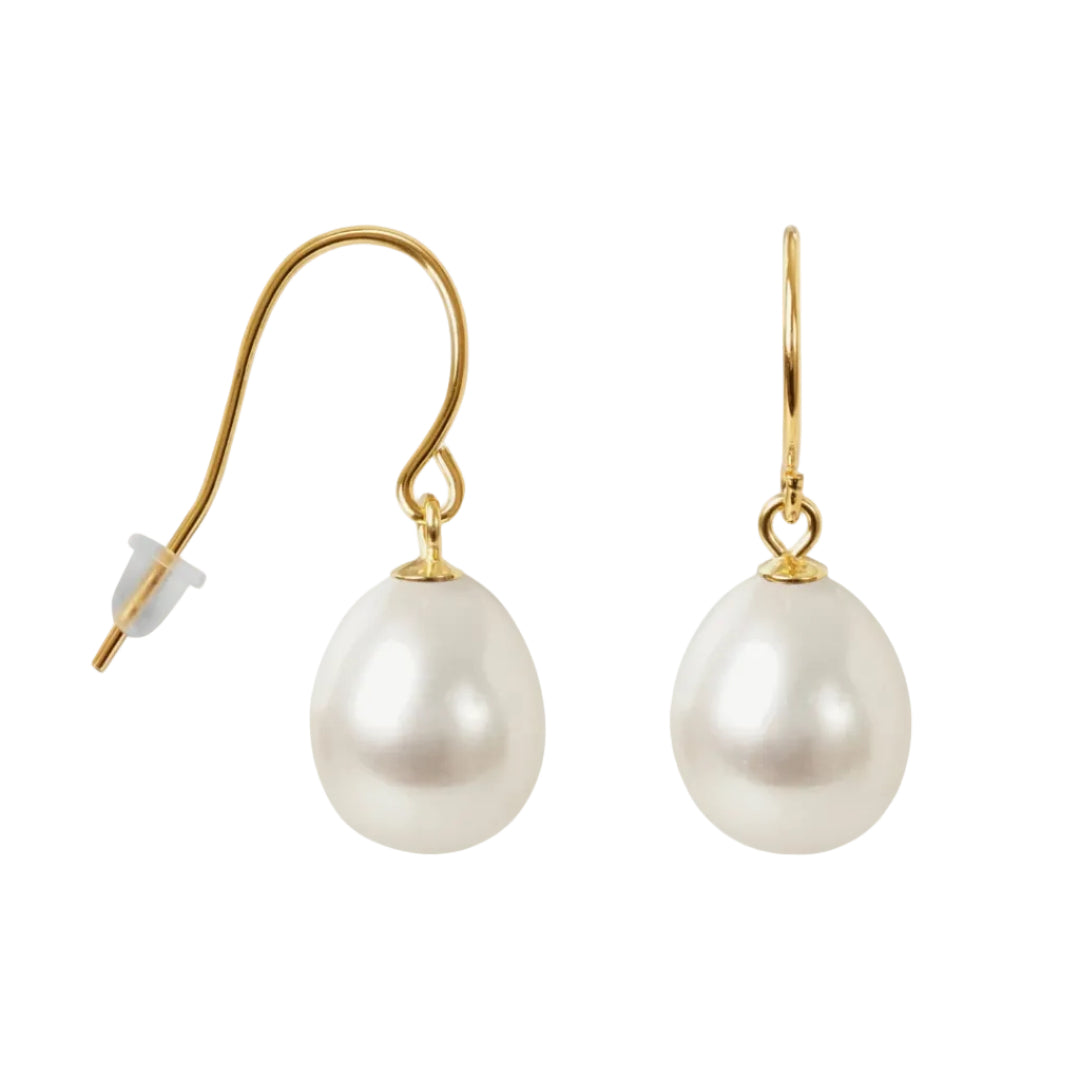 Pearl earrings with gold hooks on a white background