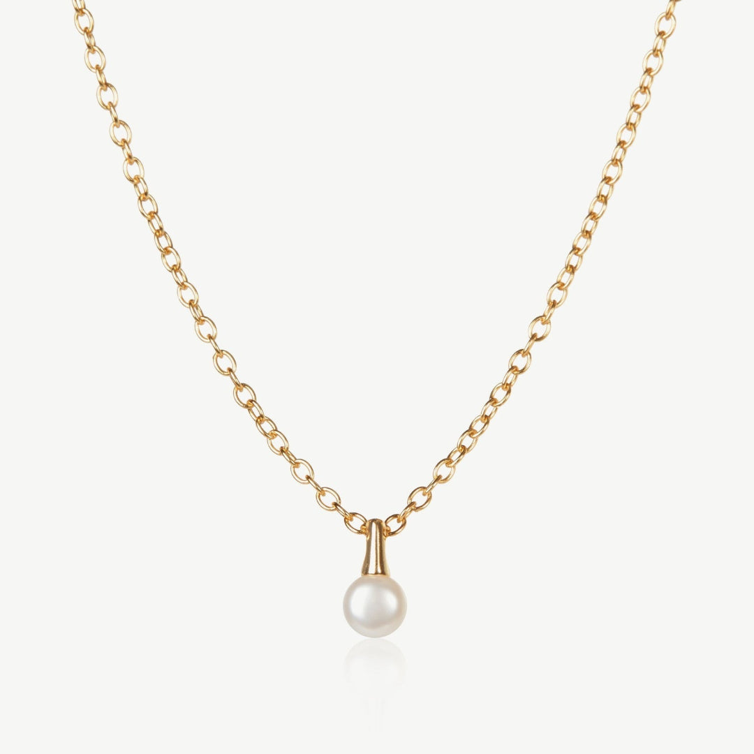 Gold necklace with a pearl pendant on a white background