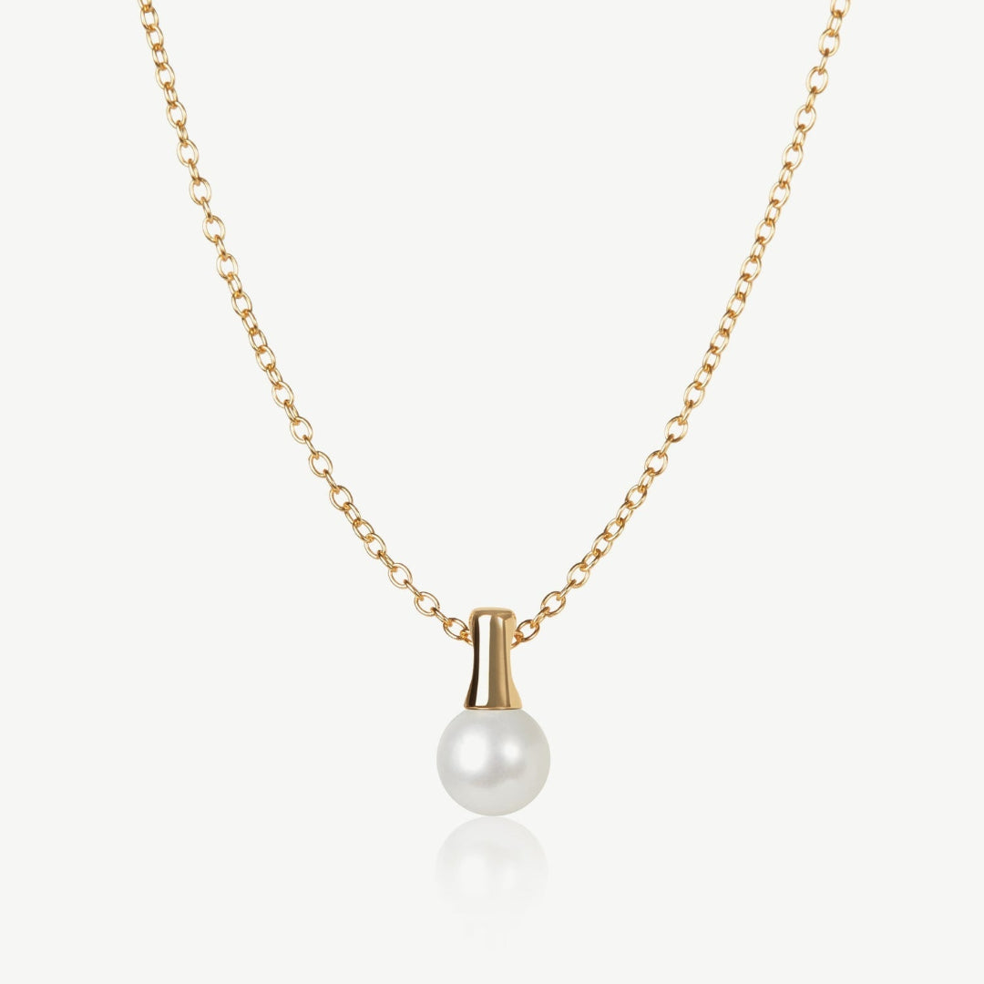 Gold necklace with a pearl pendant on a white background