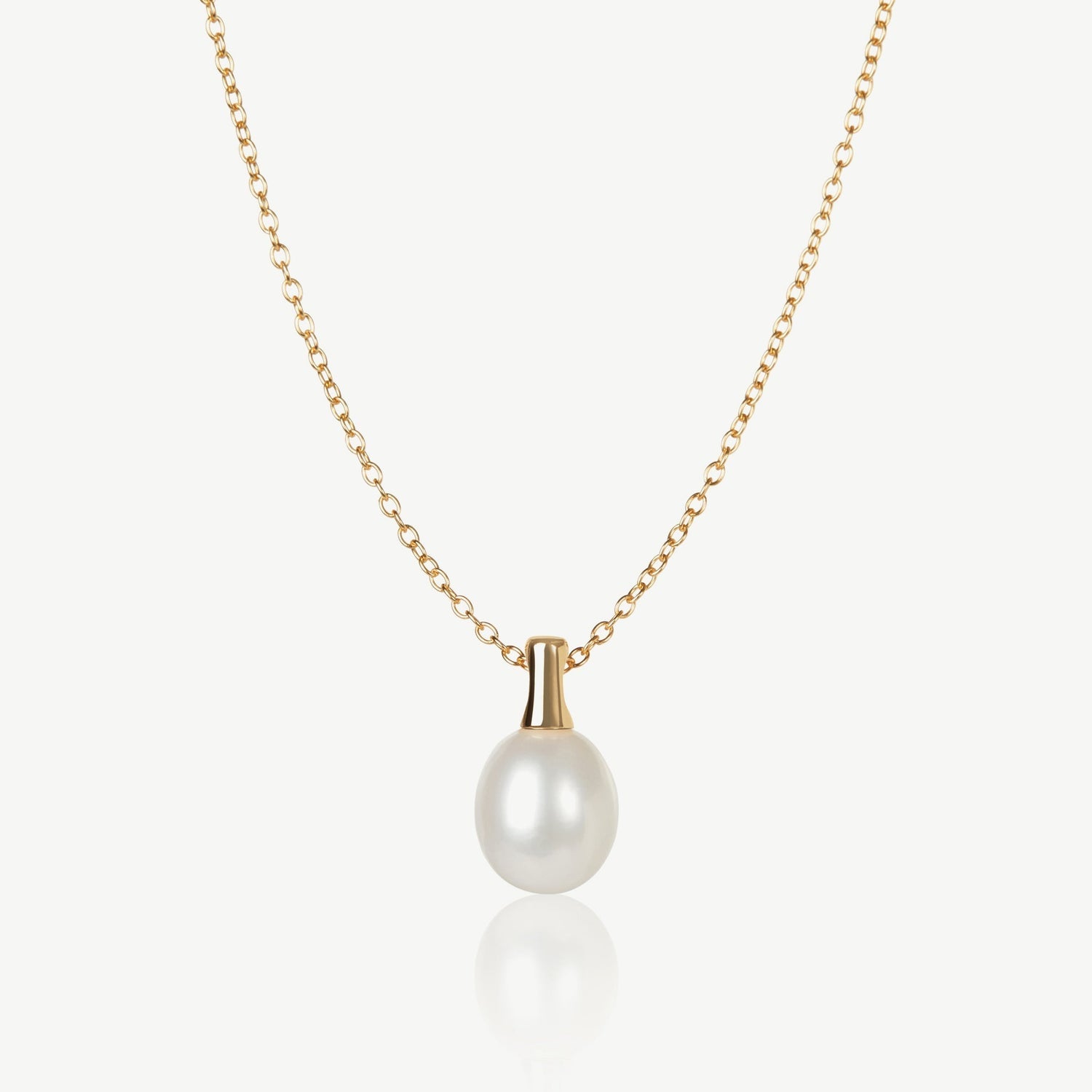 Pearl necklace with gold chain on a white background