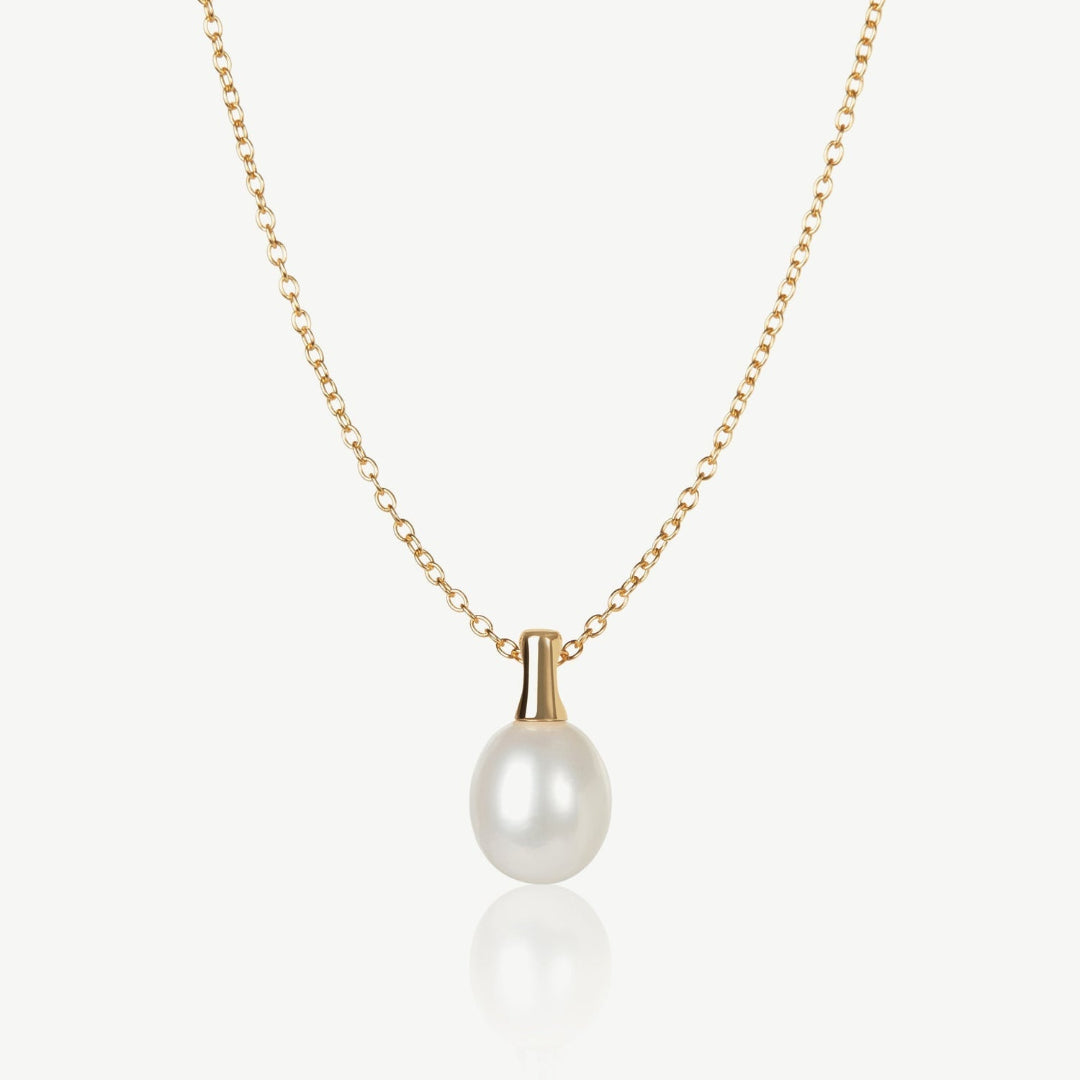Pearl necklace with gold chain on a white background
