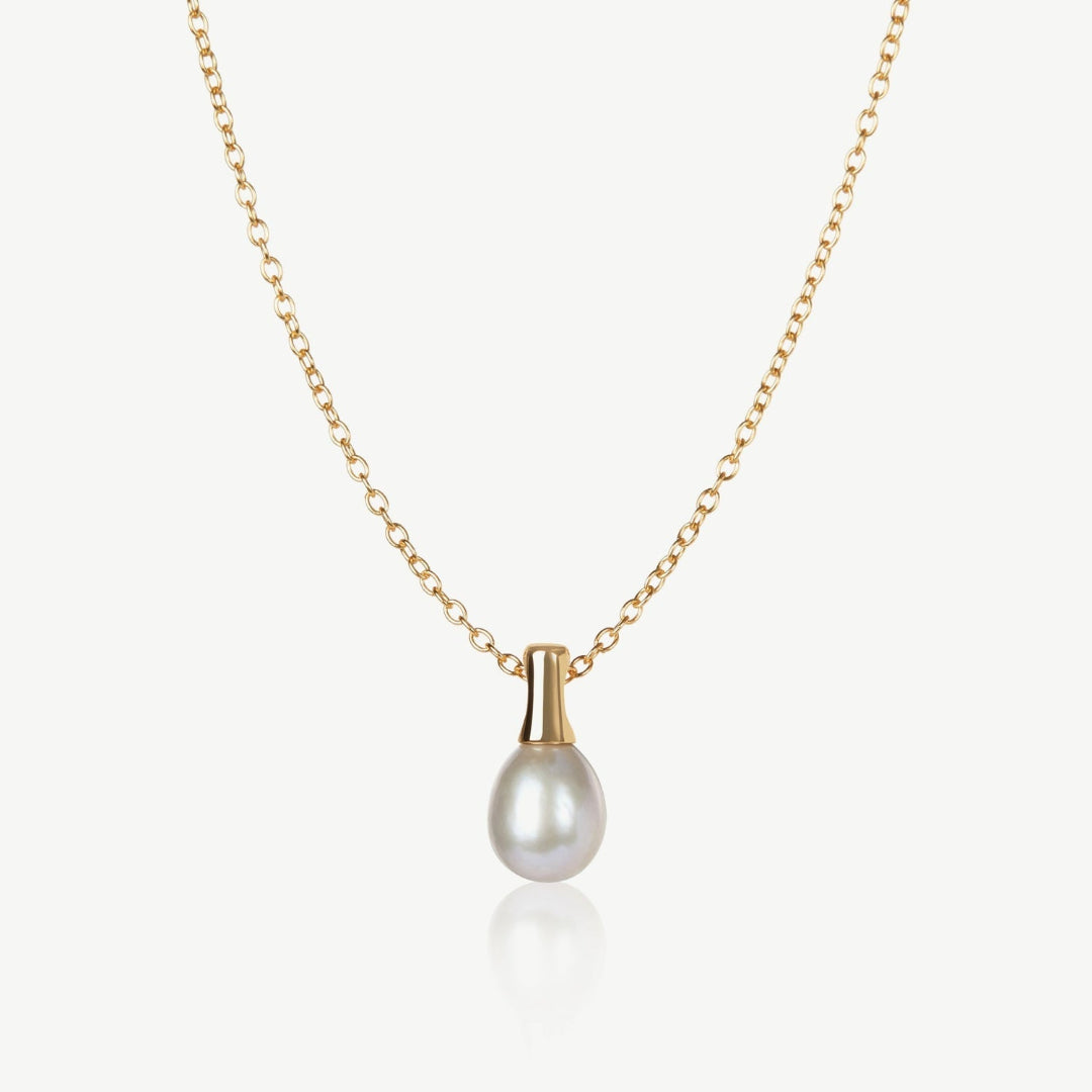 Gold necklace with a pearl pendant on a white background