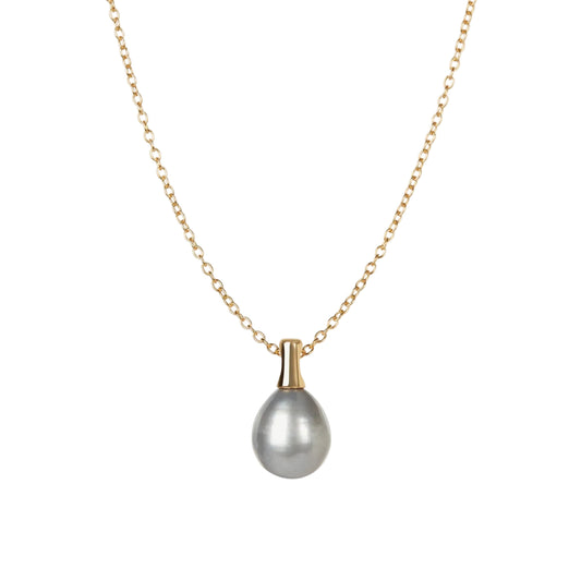 Pearl necklace with gold chain on a white background