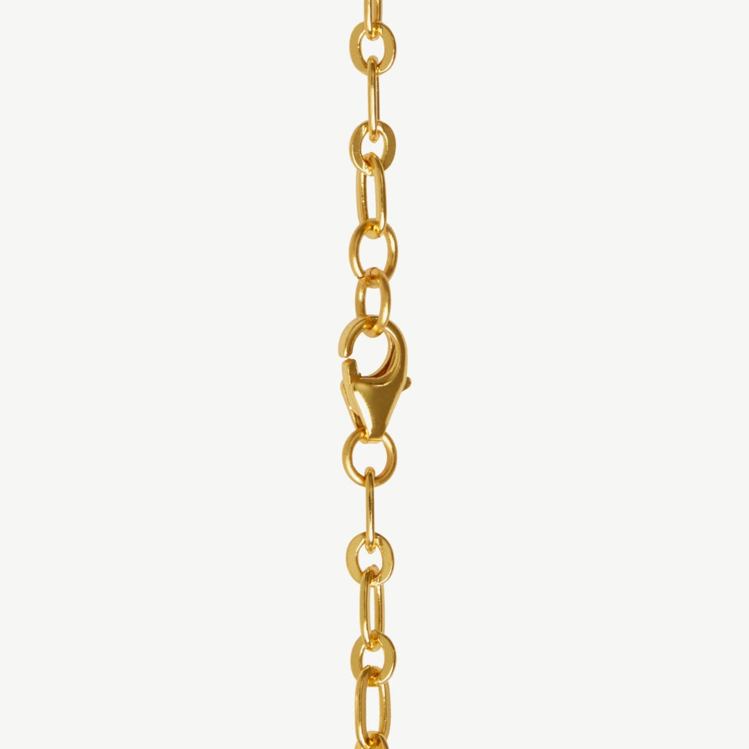 Gold chain necklace on a white background