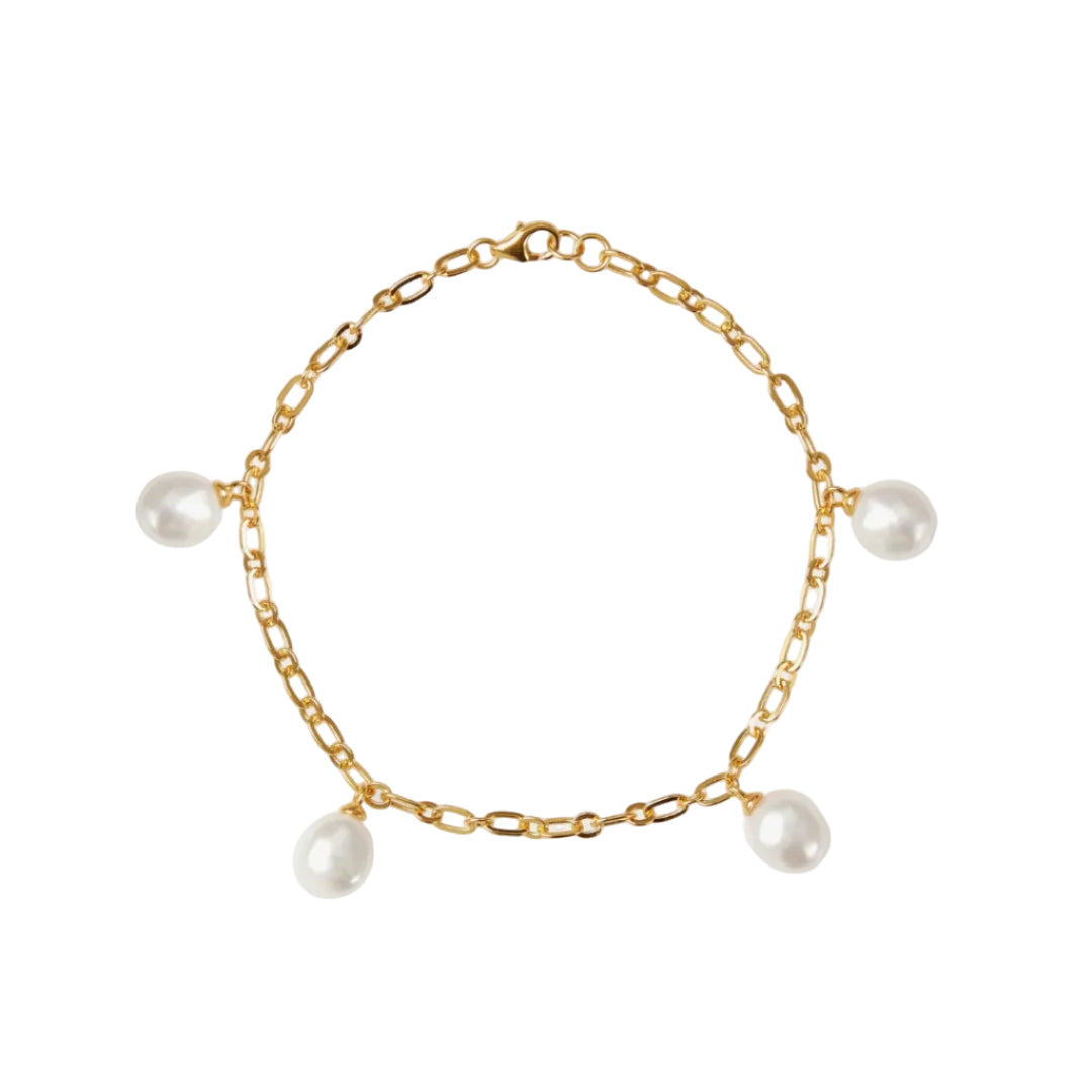 Gold chain bracelet with pearls on a white background
