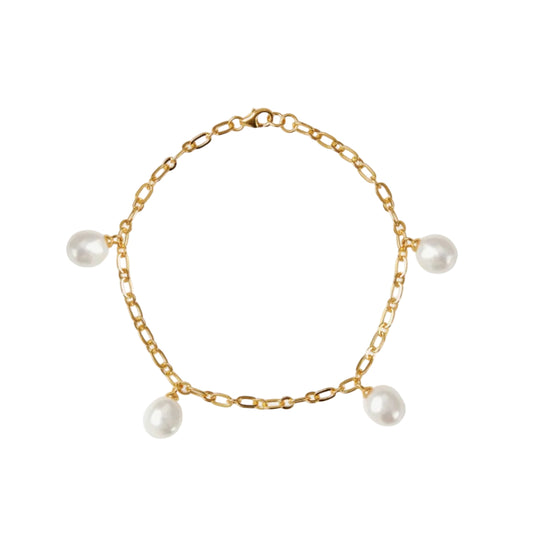 Gold chain bracelet with pearls on a white background