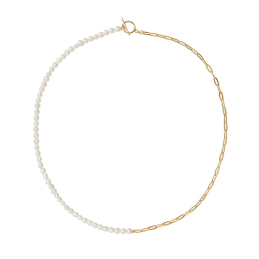 Gold chain necklace with pearl beads on a white background