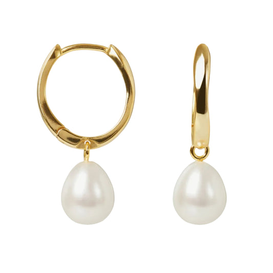 Gold hoop earrings with white pearls on a white background