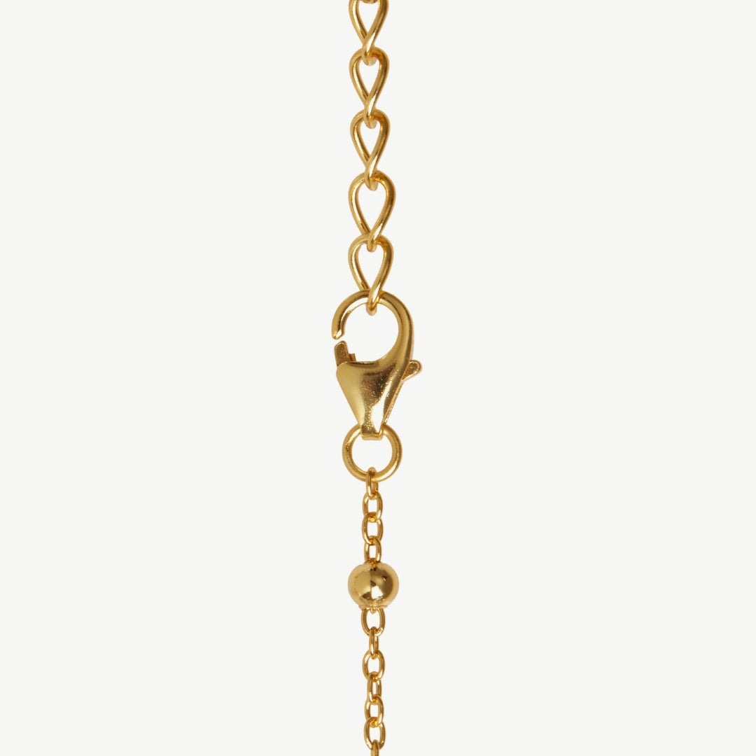 Gold chain with clasp on a white background