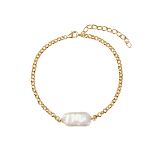 Gold chain bracelet with a single pearl on a white background