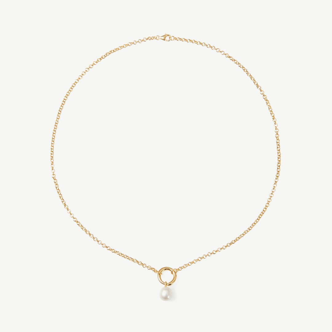 Gold necklace with a small pearl pendant on a white background