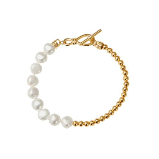 Pearl bracelet with gold chain on a white background
