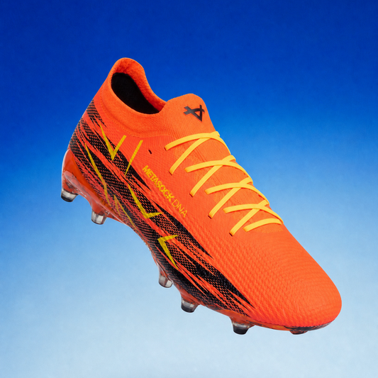 Orange soccer cleat with black and yellow accents on a blue gradient background